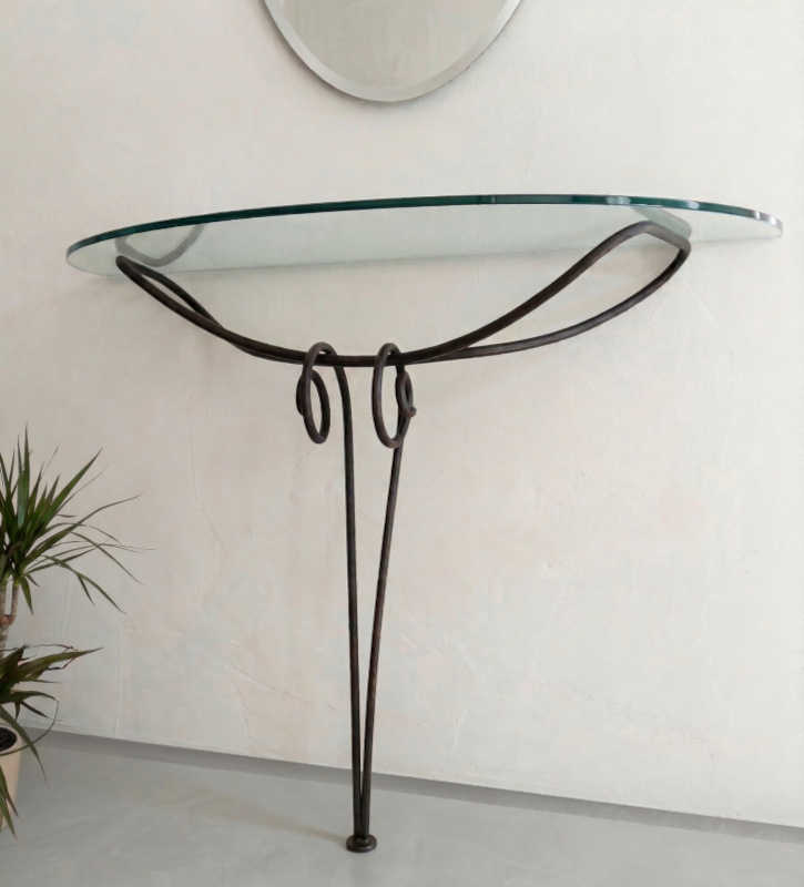 Wrought iron console table with glass top and wall mounted oval mirror contemporary design